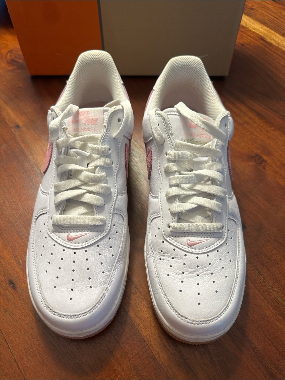 Nike Low-Top White Sneakers with Pink Swoosh Accents